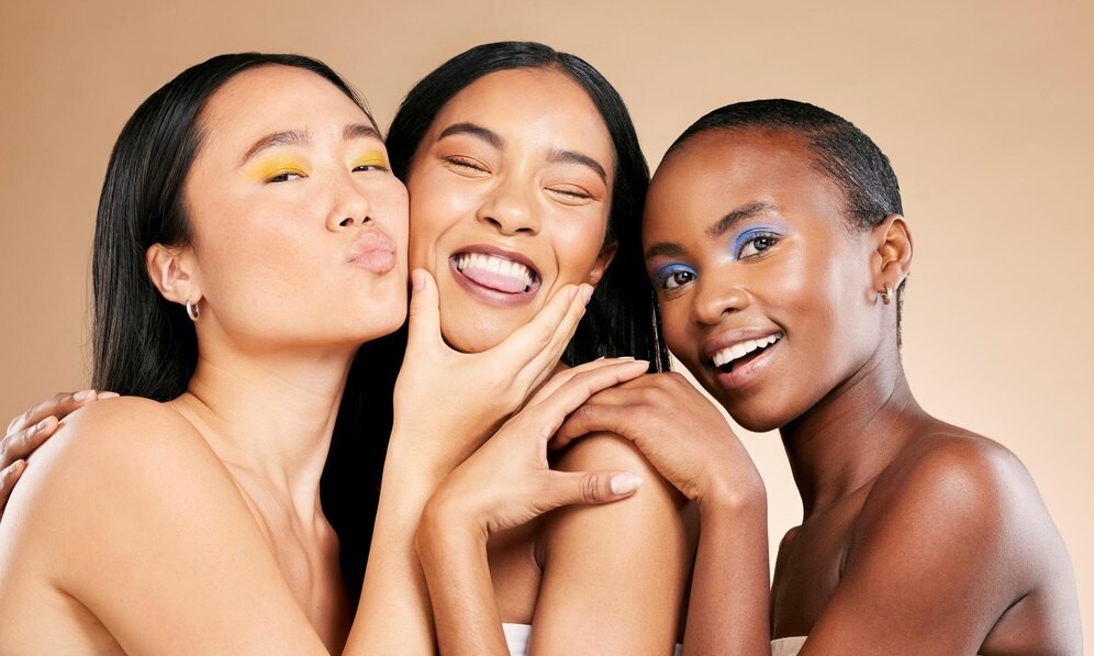 Three women celebrating beauty, confidence and radiant skin